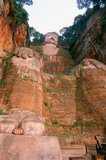 The Leshan Giant Buddha (Lèshān Dàfó) was built during the Tang Dynasty (618–907 CE). It is carved out of a cliff face that lies at the confluence of the Minjiang, Dadu and Qingyi rivers in the southern part of Sichuan province in China, near the city of Leshan. The stone sculpture faces Mount Emei, with the rivers flowing below his feet. It is the largest carved stone Buddha in the world and at the time of its construction was the tallest statue in the world.